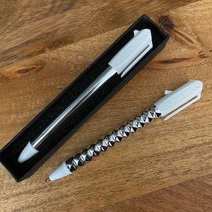 Crush pen! Refillable and writes very well, black gel ink